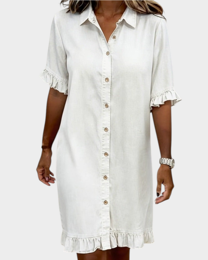 Aurore Paris light beige cotton denim shirt dress featuring a button-down front, collar, and ruffled sleeve hems.
