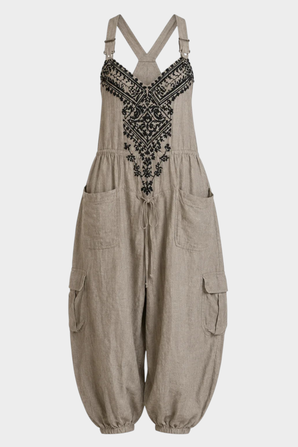 Aurore Paris ESTELLE bohemian jumpsuit in beige linen with black artisanal embroidery, adjustable straps, and pockets.