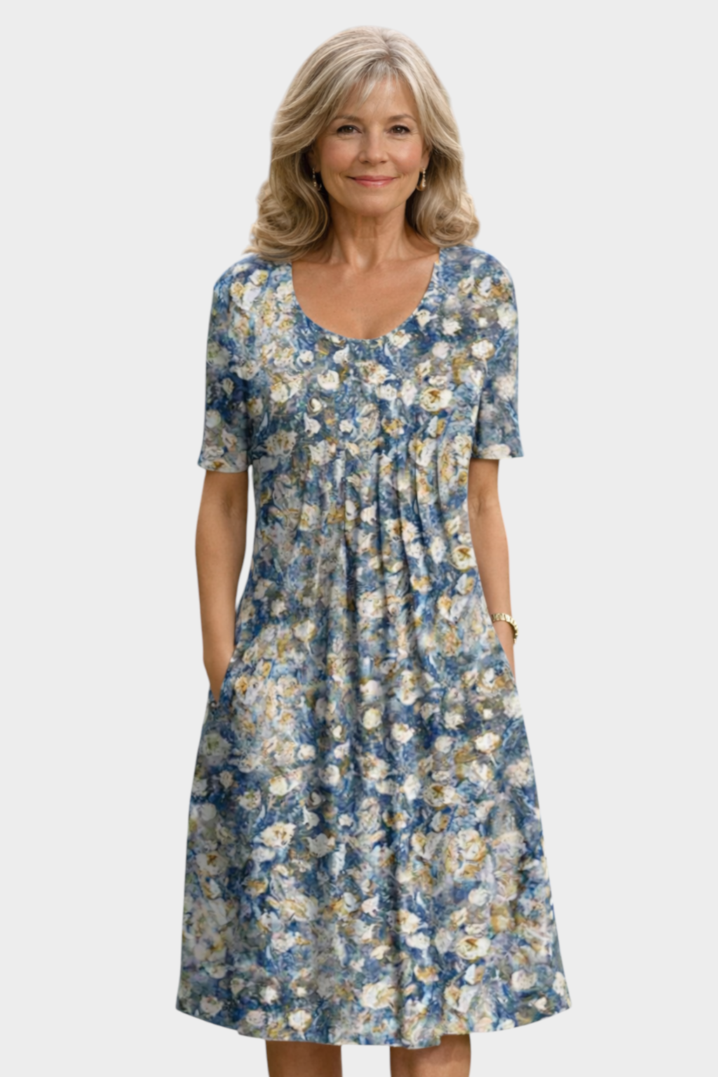 Aurore Paris floral midi dress with a round neckline, short sleeves, and front pleats on a mature blonde woman.